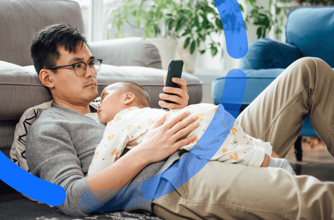 man with baby on phone superannuation